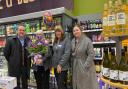Julie, holding the flowers, with Paul Chudley, the regional operational manager (left) and other colleagues at the Co-op store