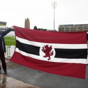 Polly Rhodes and her husband Dave display the new Somerset CCC flag.
