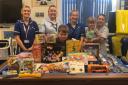 Toby and members of staff at Musgrove Park Hospital with the toys and games donated by the Keates family. Picture: Sam Keates