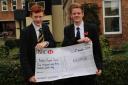 Jake Barker (left) and Tom James with their whopping cheque.