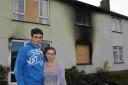 ANTON Gray back at the scene of the fire with Faye Brown, who witnessed the incident. PHOTO: Geoff Hall