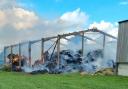 Firefighters tackle 300 TONNES of hay ablaze in barn