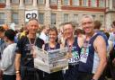 FROM left, Simon Hall, Amanda Mooney, Phillip Hodson and Neil Plumridge at the finish line with their copy of the News.