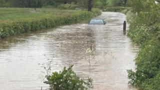 A car stuck in floodwater in the Wellington area