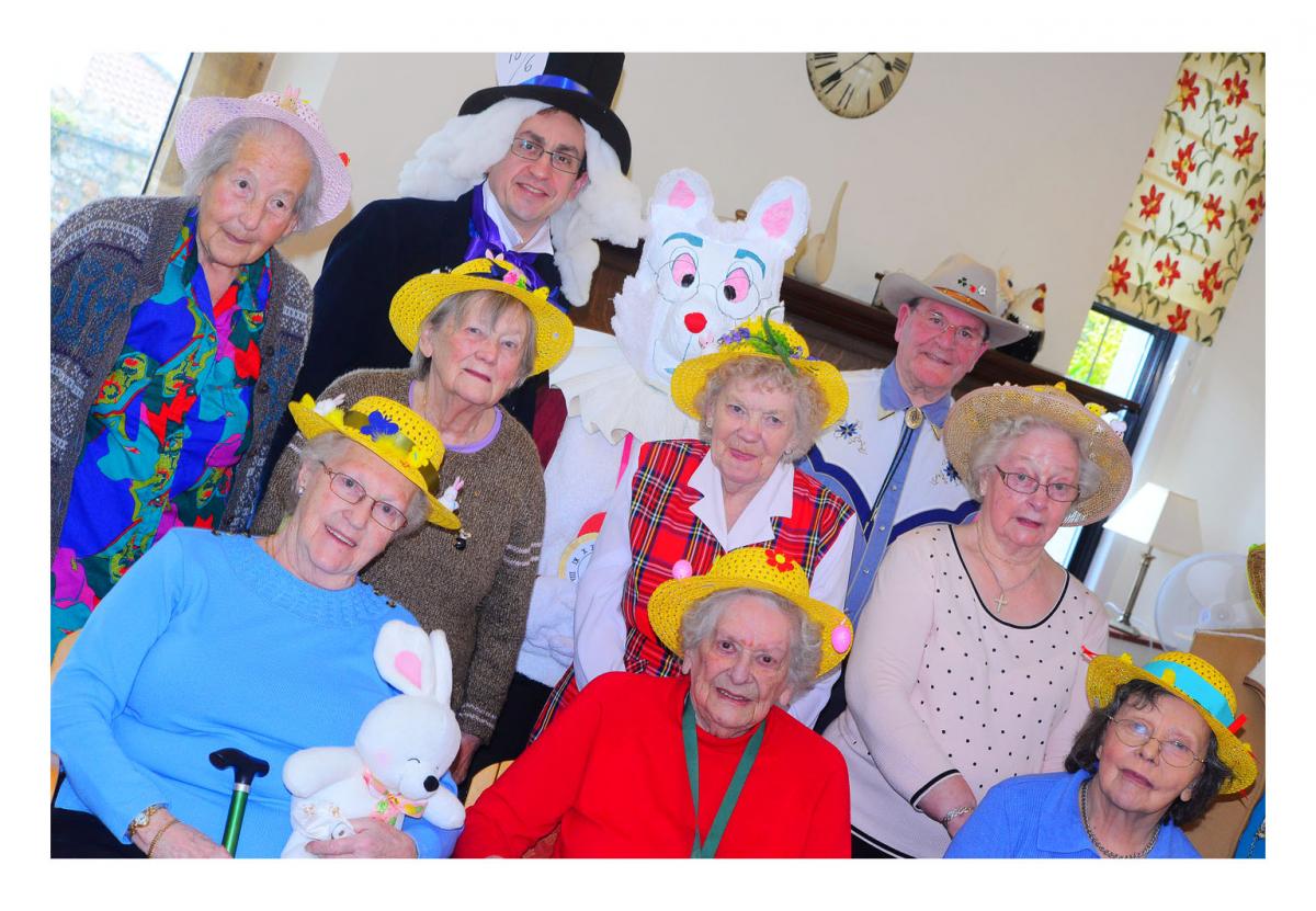 Bonnet parade participants with guest of honour, Easter bunny