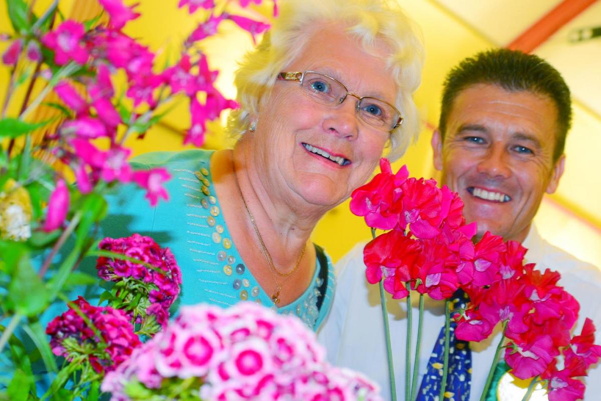 FLOWER POWER: Committee member Jean Down and Grant Davies, the summer show chairman