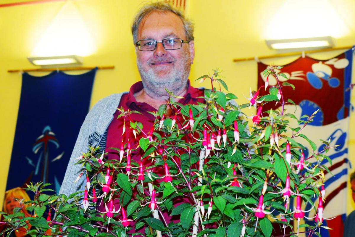 POTTED PRIZE WINNER: John Dilloway with his winning Flower Pot Plant