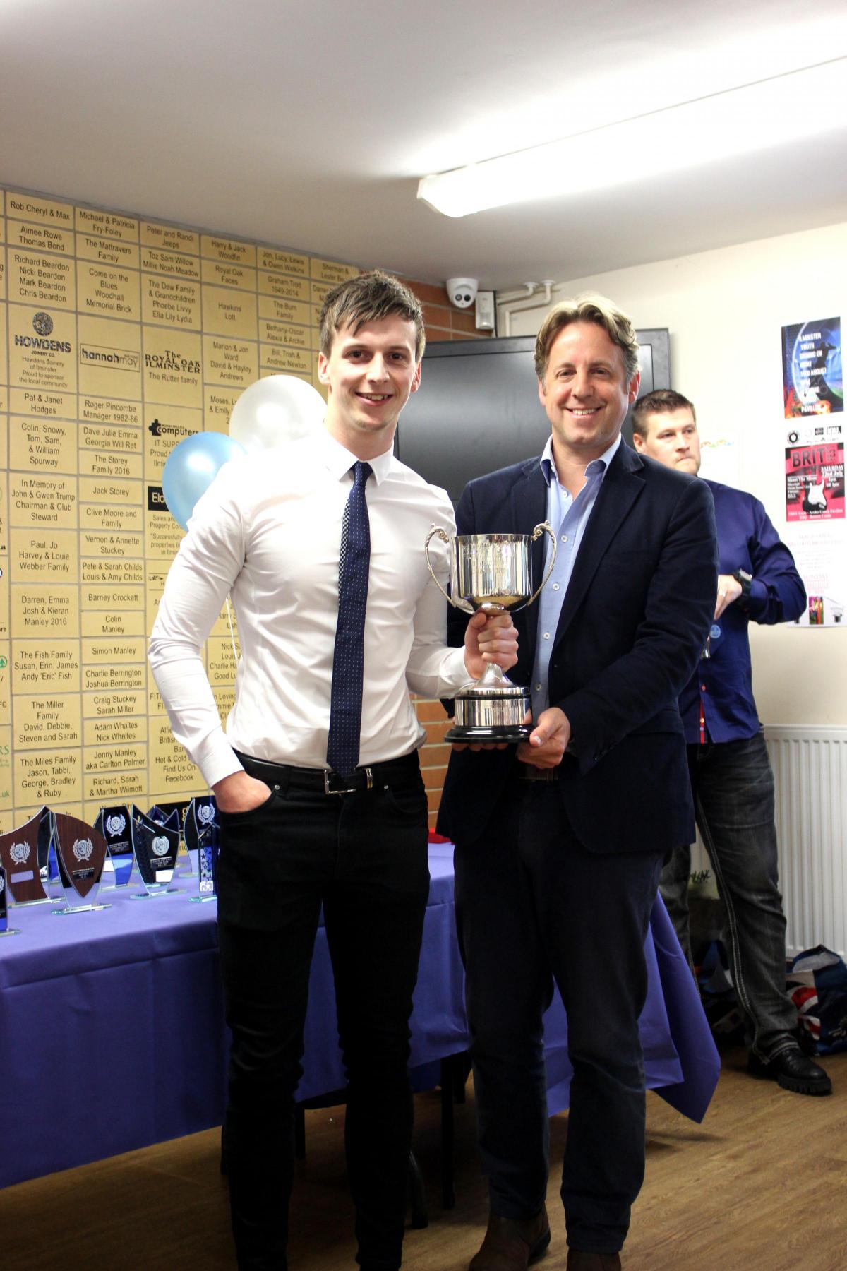 Marcus Fysh presenting captain Luke Paul with the Devon and Exeter Division 7 Champions Trophy won by the Men's Reserves.