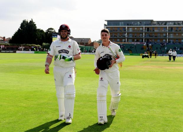 Chard & Ilminster News: VICTORY: Davies, left, with Somerset captain Tom Abell