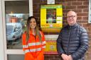 National Grid’s Jade Rainey with Clive Adams and the new defibrillator located at Millfield Café.
