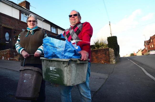 OUTRAGE: Bob and Liz Taylor, with their recycling bins on Furnham Road