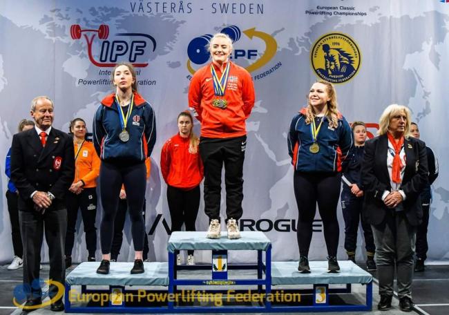 PODIUM: Emily Greenway, right, on the podium at the European Powerlifting Championships