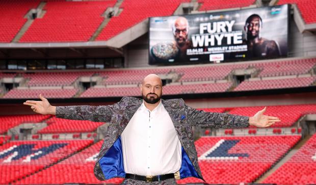 Chard & Ilminster News: Tyson Fury poses on the pitch after the press conference at Wembley Stadium, London (PA)