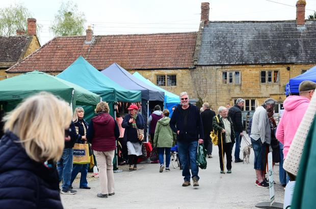 Chard & Ilminster News: People enjoy shopping and browsing at the outside stalls at Yandles in Martock. Pictures: Steve Richardson