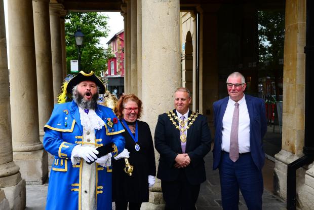 Chard & Ilminster News: Welcoming committee at the Guildhall in Chard town centre ; Stuart Cumming [Town Crier], Viv Cumming [Mace Bearer], Jason Baker [Mayor of Chard] and Paul Russell [Town Clerk]