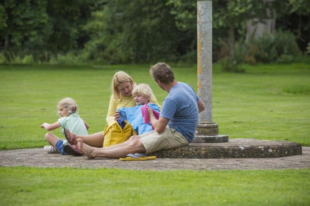 A family relaxing on the lawn at Barrington Court. Picture: National Trust Images/James Dobson