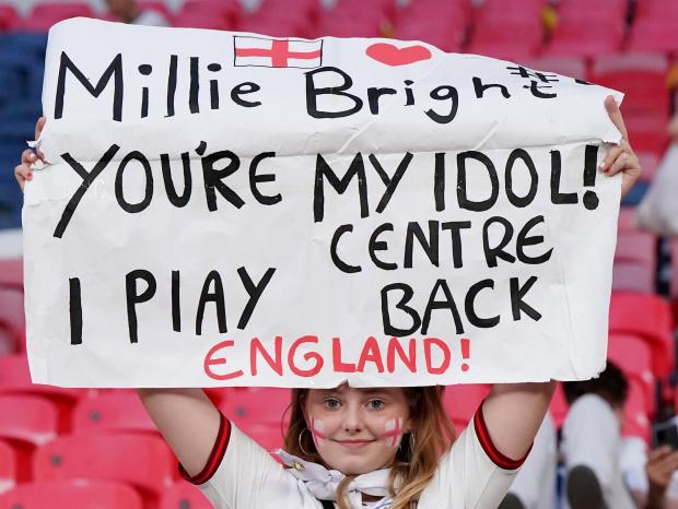 Chard & Ilminster News: An England fan holds a "Millie Bright You're My Idol" sign in the stands as England celebrate winning the UEFA Women's Euro 2022 final at Wembley Stadium, London. Picture date: Sunday July 31, 2022.