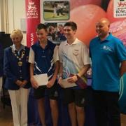 ACHIEVEMENT: Pictured from left - Hazel Marke (Bowls England president), Oli Collins, Daniel Agar, sponsor Sutton Winson