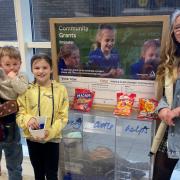 Children and their parents spoke to shoppers at Tesco in Ilminster to help bring a new seesaw to Donyatt Recreational Area. Picture: Sarah Young