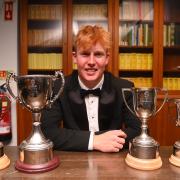 James Rew with his awards haul.