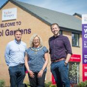 Crewkerne Mayor, Cllr Alice Samuel with Taylor Wimpey staff at Wool Gardens